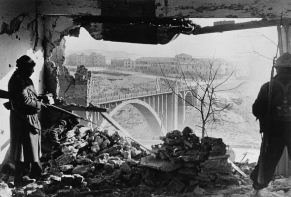 SPAIN. January 3rd, 1938. Aragon front. Battle of Teruel. Republican soldiers inside the Governor's Palace, the last bastion of the Fascist resistance by Robert Capa