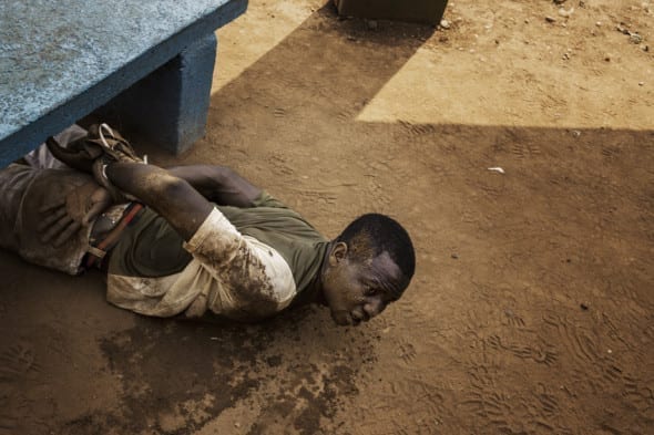 CAR in Chaos Bangui A man arrested by MISCA (Mission Internationale de Soutien a la Centrafrique Sous Conduite Africaine) soldiers lies on the ground with his wrists tied. He was found with a grenade in a pocket by William Daniels