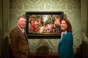 Ben van Doesburgh and Emilie Gordenker pose with Pieter Lastman's St John the Baptist Preaching.