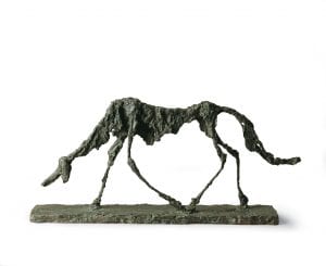 Alberto Giacometti, Il cane, 1951, bronzo, cm 47 x 100 x 15. Saint-Paul-de-Vence, Fondation Marguerite et Aimé Maeght © Claude Germain - Archives Fondation Maeght (France) © Alberto Giacometti Estate / by SIAE in Italy 2019