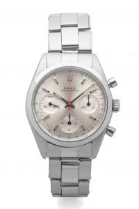 LOT 103 ROLEX, REF. 6238, PRE-DAYTONA, GEORGE LAZENBY « JAMES BOND », STEEL Fine and extremely rare, stainless steel, manual-winding wristwatch with silver dial, three registers and red chronograph hand. Rarissime et superbe chronographe en acier. Boîtier rond. Couronne et fond vissés. Cadran argent avec trois compteurs. Trotteuse centrale du chronographe rouge. Mouvement mécanique manuel. Brand Rolex Reference 6238 Year Circa 1965 Calibre  722 Case No. 1206513 Bracelet  Rolex Oyster riveted stainless steel 7205/06 Dimensions 36 mm Signature Case, dial and movement Accessories Original invoice from Bucherer, Christie’s London sale purchase invoice, Bijoux Signés Ltd. purchase invoice, black and white picture of a scene of the motion picture with Caterina Von Shell and George Lazenby. EUR 300,000 - 500,000