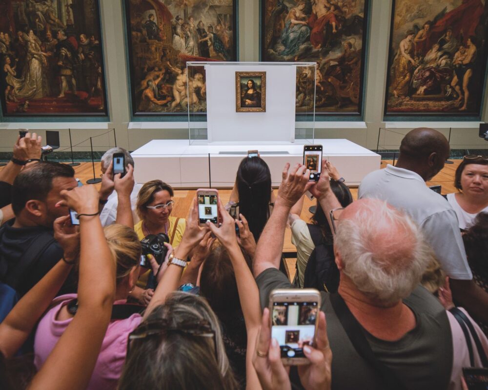 Mona Lisa being besieged by hundreds of Tourists just waiting for 60 seconds of time in front of this picture. Paris Picdump #3 Louvre Ph. Mika Baumeister