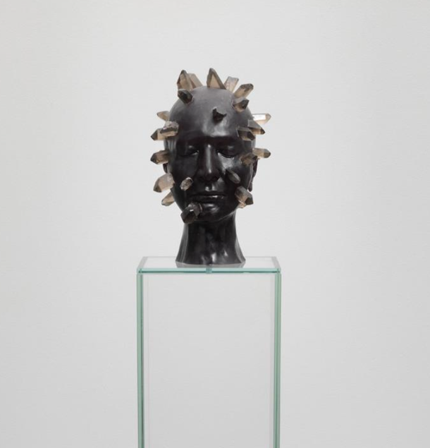 Marina Abramovic | The Communicator, 2012 | Black wax with black quartz stones, glass pedestal | 60x60x60 cm; pedestal 130x24x24 cm