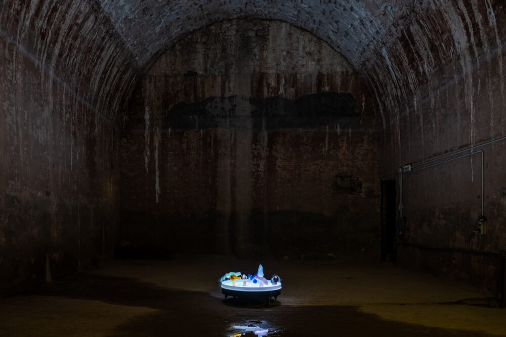 Marco Giordano, Interlude, 100 cm diameter, Coloured glass, plexiglass, diffusers, water, led lights, speakers, amplifier, electric components. Cisterne di Palazzo Pubblico, San Marino