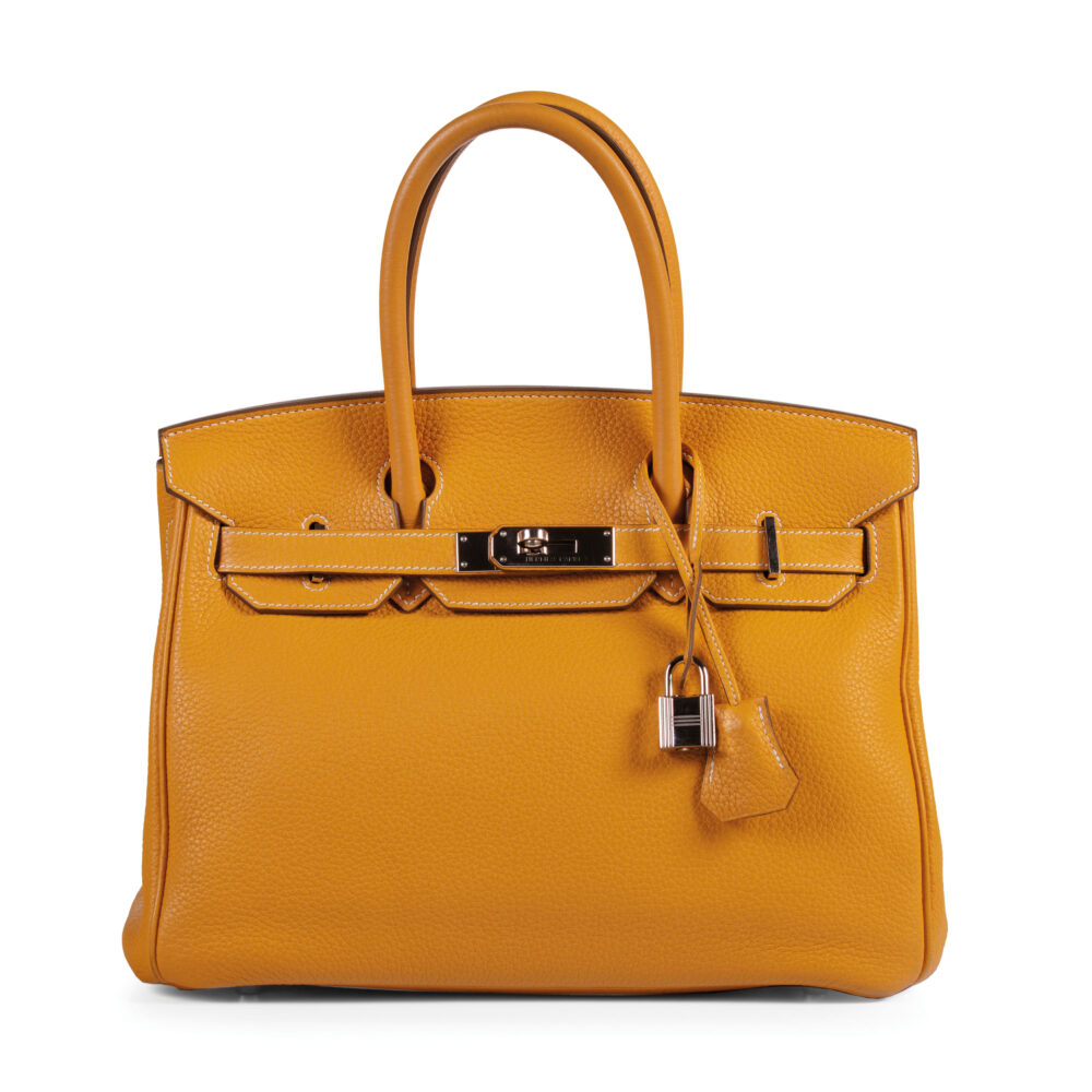LOT 319. HERMÈS MOUTARDE BIRKIN 30 IN TAURILLON CLEMENCE LEATHER WITH PALLADIUM HARDWARE, 2012. SOLD AT 7.260 EURO