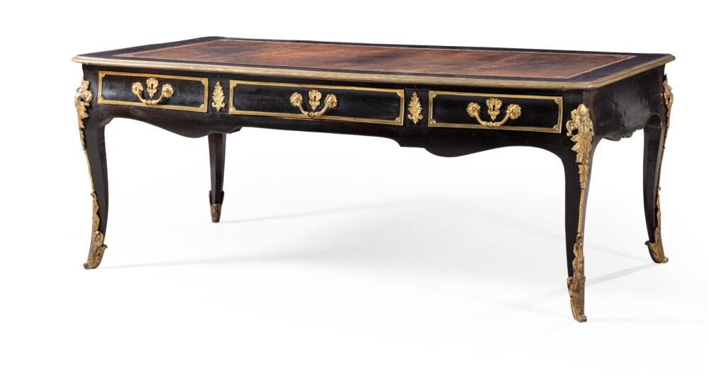 A Louis XV pearwood b ureau plat, mid - 18 th century with later gilt - bronze mounts Height 31 in; width 79 in, prof 40½in Est. : 20,000 – 30,000 EUR