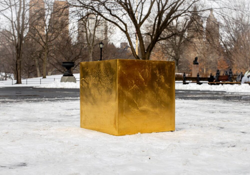Niclas Castello's The Castello Cube, made entirely from 24-carat, 999.9 gold and weighing 410 pounds, was installed in Central Park, New York for one day only, Wednesday, February 2, 2022. Photo by Sandra Mika.