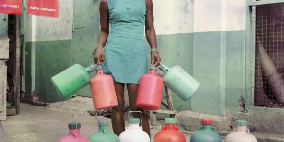 James Barnor, Sick-Hagemeyer shop assistant with bottles, taken as a colour guide, Accra, 1971 © James Barnor/Autograph ABP, London