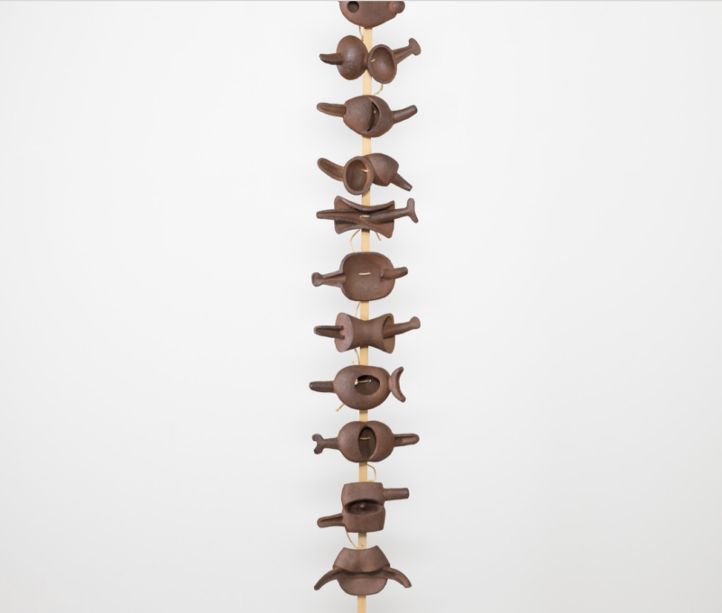Isamu Noguchi, Even the Centipede, 1952. Unglazed Kasama red stoneware, wood pole, and hemp cord. 165 5/8 x 18 x 18 in. Collection of The Museum of Modern Art, New York; A. Conger Goodyear Fund, 1.1955.a-k. © INFGM / ARS