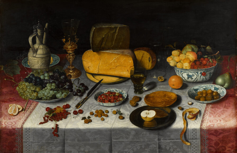Floris Claesz. van Dyck, A still life of fruit and olives in various blue and white Chinese export porcelain bowls, a Siegburg stoneware ewer, a Berkemeyer conical roemer in a silver-gilt mount,