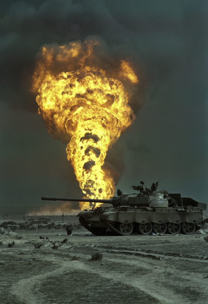  Livio Senigalliesi, 7th March 1991 An oil-well burns out of control beyond an abandoned Iraqi T55 tank in the Burgan oilfield, south of Kuwait City.