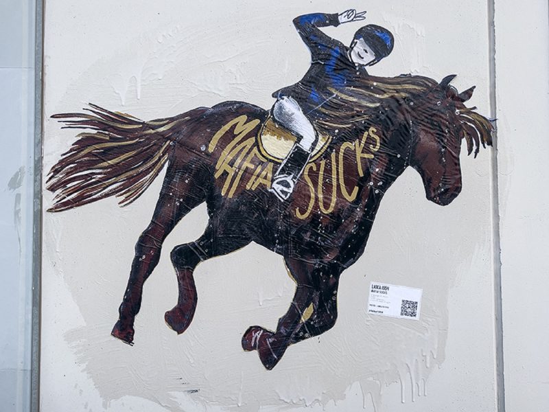 poster della street artist Laika affisso di fronte al carcere dove è rinchiuso Messina Denaro