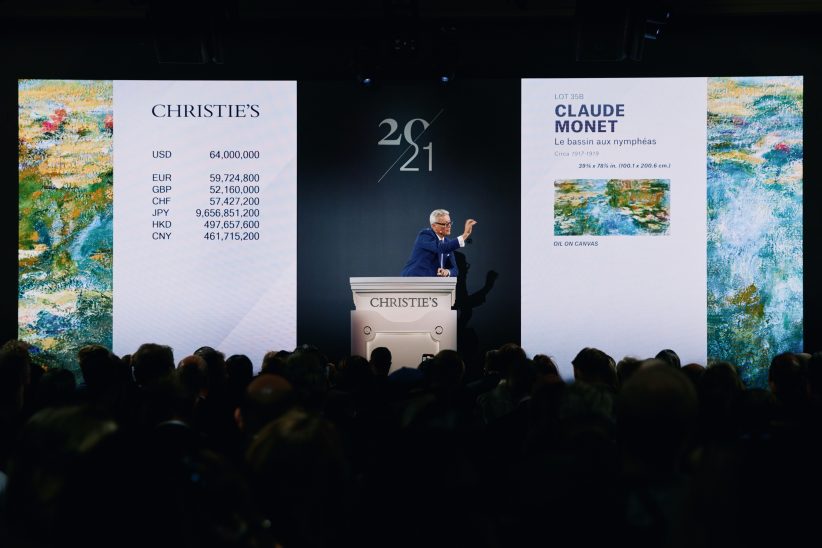 Jussi Pylkkänen, Christie’s auctioneer and global president, sells the top lot of the 20th Century Evening Sale, Claude Monet’s Le bassin aux nymphéas for $74,010,000 (Courtesy of Christie’s)