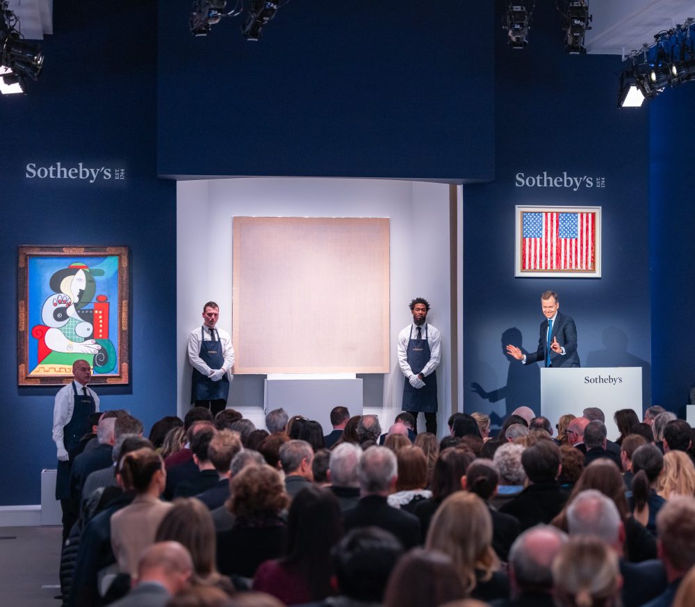 Sotheby's Chairman and Auctioneer Oliver Barker fielding bids during the auction-1