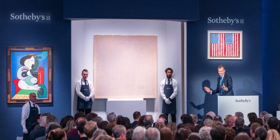 Sotheby's Chairman and Auctioneer Oliver Barker fielding bids during the auction-1