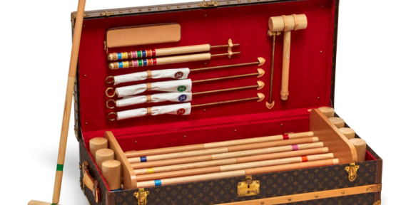 A special order monogram canvas croquet trunk with brass hardware. Sold for 30.240
