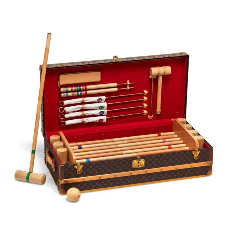 A special order monogram canvas croquet trunk with brass hardware. Sold for 30.240