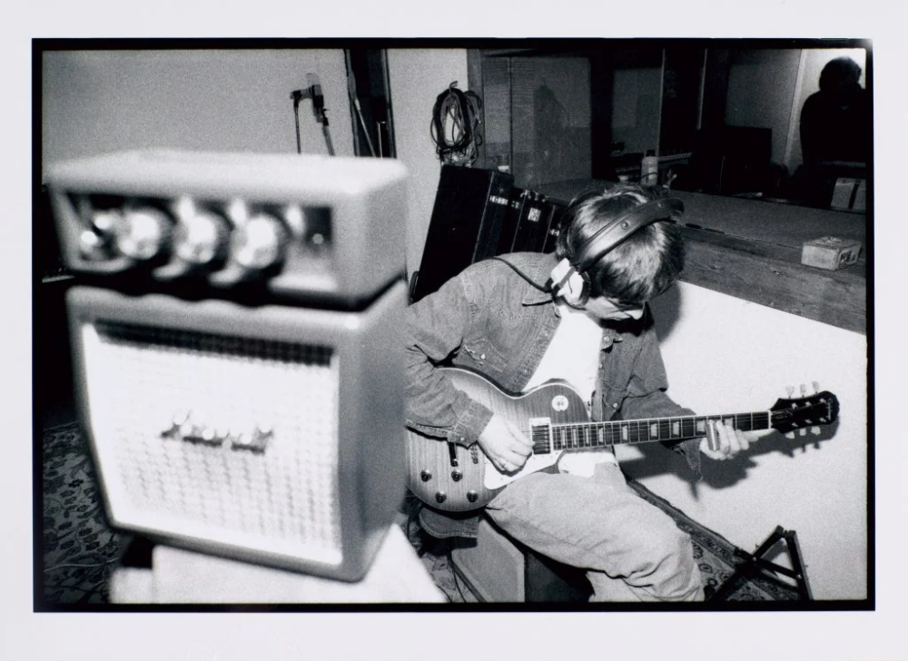 Oasis frontman Noel Gallagher playing the Epiphone Les Paul Standard guitar included in this month's sale. Courtesy of Sotheby's