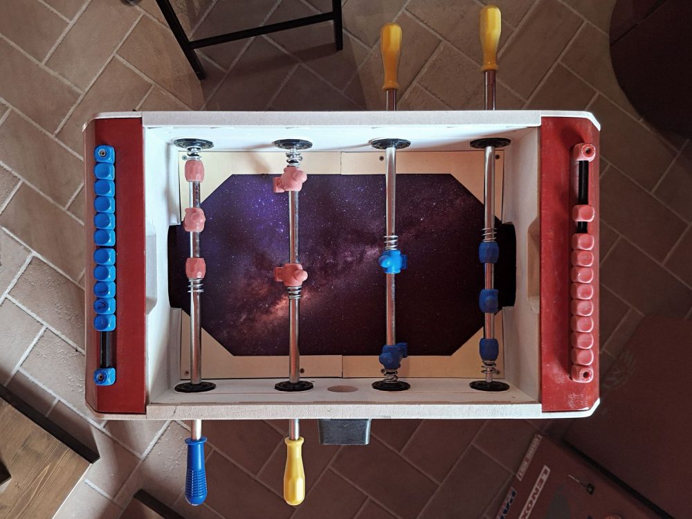 Giovanni Gaggia, Oltre l’ultimo cielo, 2025, installazione, calciobalilla a due aste con piano stellato, Courtesy l’artista