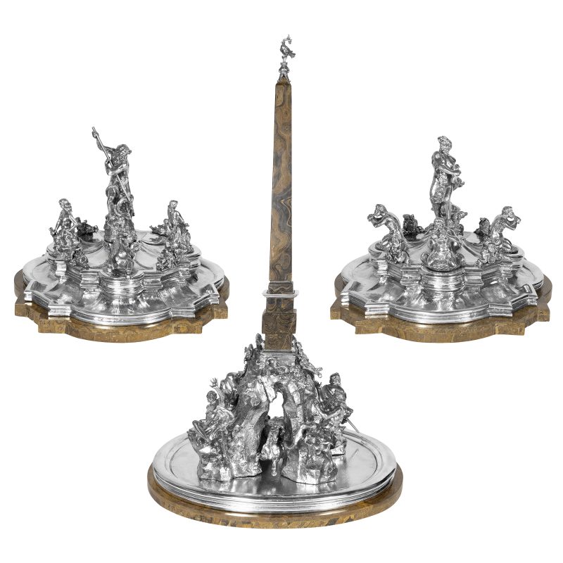 Lotto 70, Surtout de table in argento e base in marmo, raffigurante le tre fontane berniniane di Piazza Navona a Roma: Fontana dei Quattro fiumi, Fontana del Moro e Fontana del Nettuno, recanti marchio della Bottega Mortet Roma, peso netto 15.560 Kg. circa. Stima 20.000-30.000 euro. Colasanti Casa d'Aste