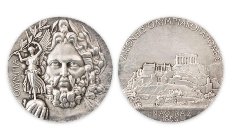 Medaglia originale dei primi Giochi Olimpici moderni, coniata in argento (66,63 g, 50 mm) dal medaglista Jules-Clément Chaplain per la Monnaie de Paris. Battuta a 50 mila euro. Wannenes