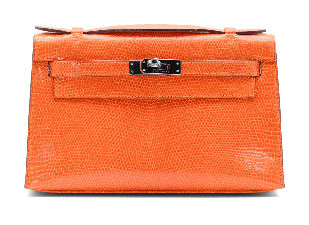 Lotto 248 HERMÈS Kelly pochette in lucertola color arancione, hardware brunito, dust bag (cm 22x13) Venduto € 20.480 Courtesy Il Ponte Casa d'Aste
